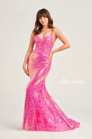 Enhance your sparkle as you step onto prom with this fabulous dress by Ellie Wilde, style EW35202. This glittery dress will have you feeling like a super model as it has a luxurious long train and a sharp looking v-shaped neckline. The open back on this dress is just one way that will have you feeling like the main focus of the night.