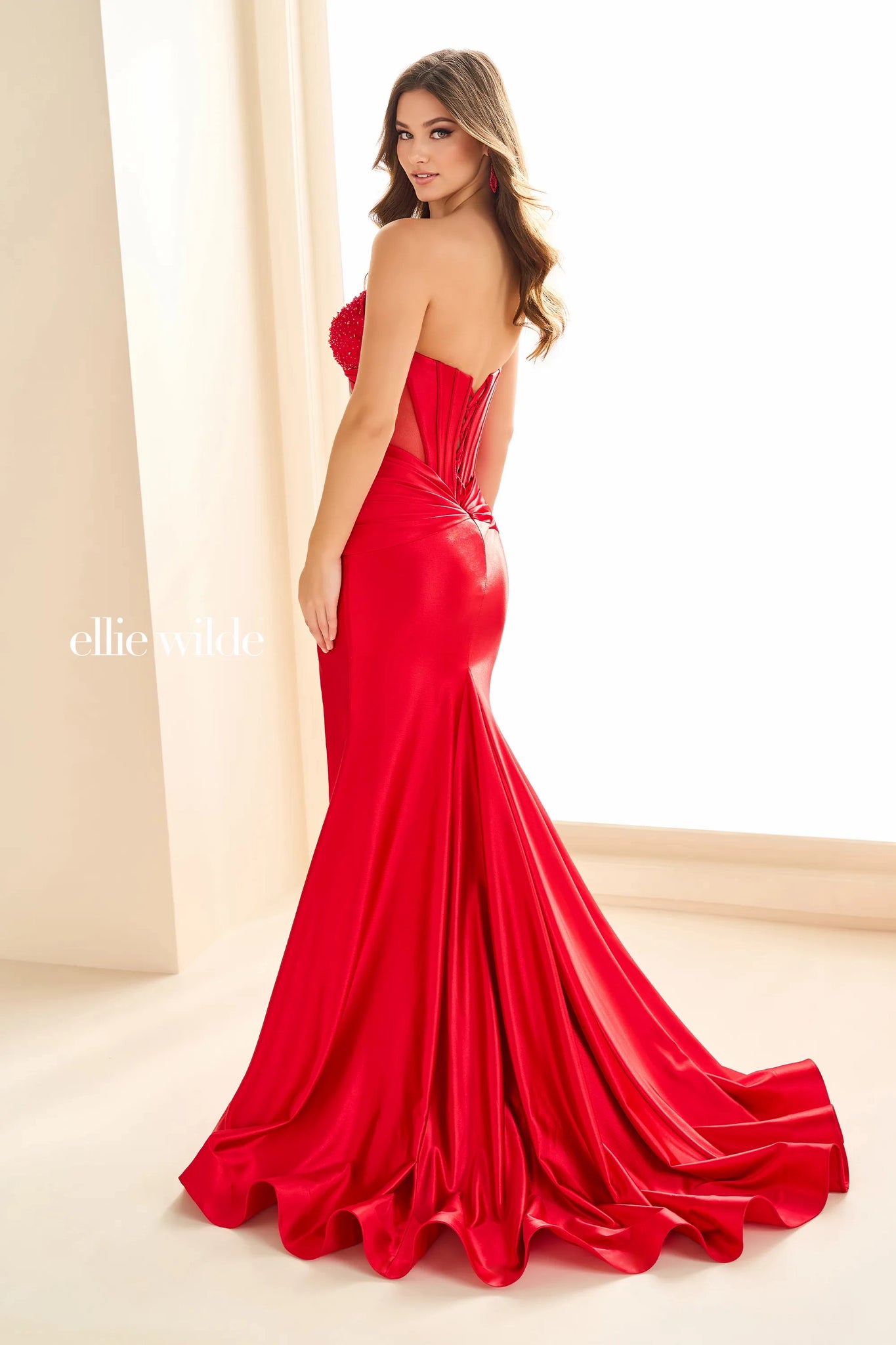 Be the star of the room when wearing this&nbsp;long dress&nbsp;by Ellie Eilde, style EW36009. This ensemble has a strapless sweetheart neckline, which comes with separate spaghetti straps leading to a sexy open corset lace up back that will hug your bodice beautifully. Embellished with glistening beadwork. The bottom is made out of jersey material that has a sexy high thigh slit and a classy simple train. You will for sure going to have all eyes on you.