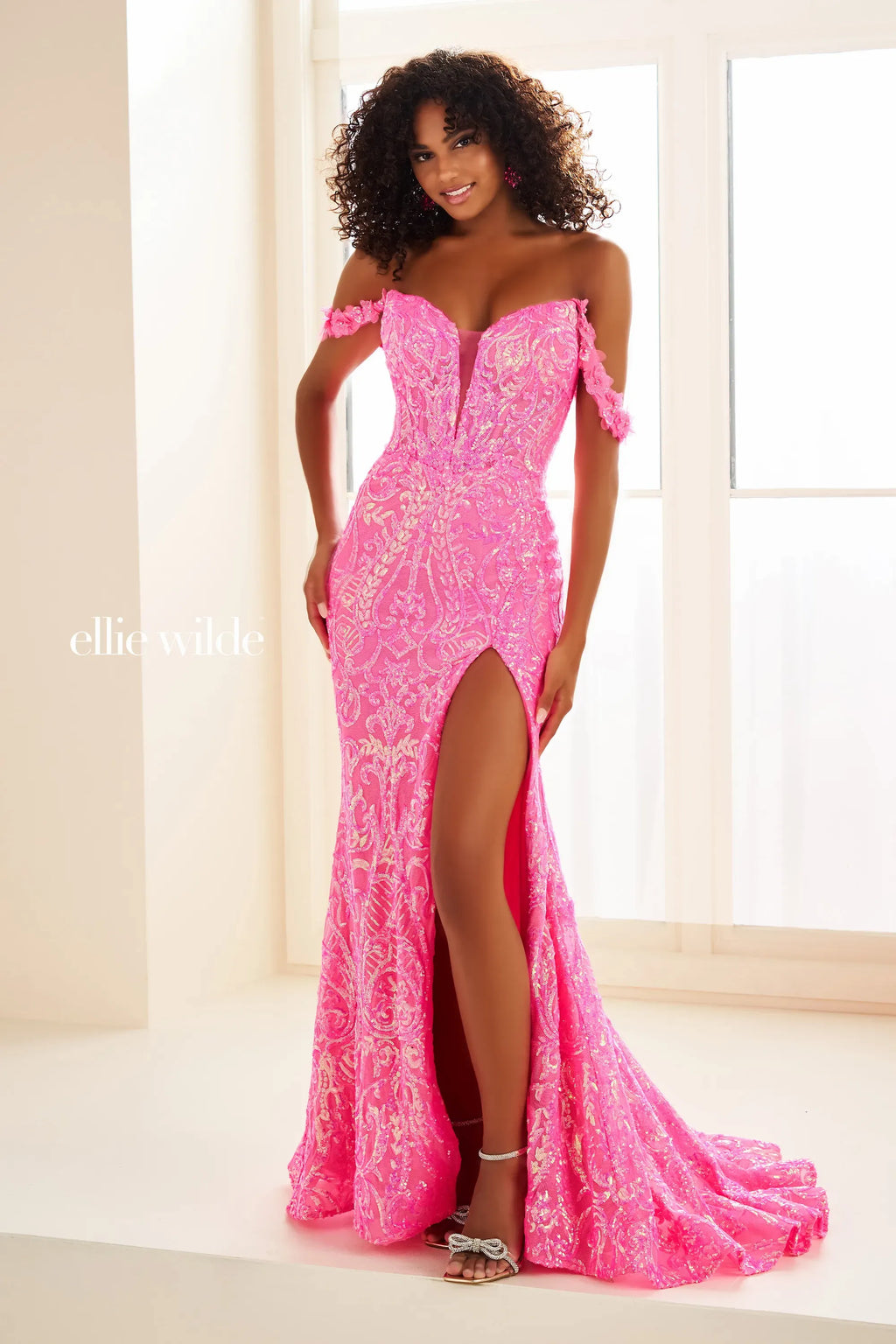 Have all eyes fall on you when you choose Ellie Wilde EW36087 for your special event. This flattering fitted silhouette showcases a sweetheart neckline with elegant off the shoulder cap sleeves. Completely decked out with unique intricate patterns of stunning embroidery, this style finishes off with a thigh high slit and sweep train.