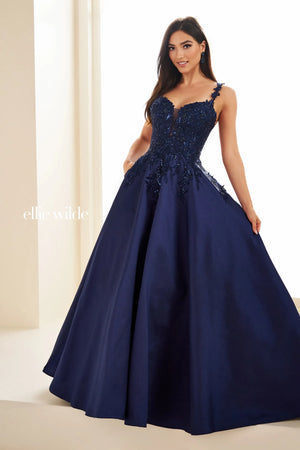 Have a memorable night in Ellie Wilde style EW36094 at your special event. This lovely A line dress showcases a modest v neckline with dainty floral shoulder straps. The fitted bodice is decorated with unique floral applique flowing into the full satin skirt ensuring you look and feel beautiful.