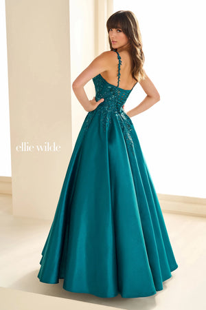 Have a memorable night in Ellie Wilde style EW36094 at your special event. This lovely A line dress showcases a modest v neckline with dainty floral shoulder straps. The fitted bodice is decorated with unique floral applique flowing into the full satin skirt ensuring you look and feel beautiful.
