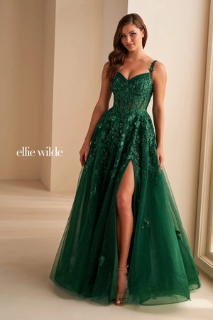 Live a real life fairy tale at this years prom wearing this princess worthy Ellie Wilde long dress style EW32604 made in regal shades of tulle fabric. This impeccable gown showcases an illusion corset bodice adorned with lace appliques and beads with thin straps that can be worn on or off the shoulder and a zipper closure back. The a line long skirt has both glitter tulle and tulle layers with a front side slit and side pockets.