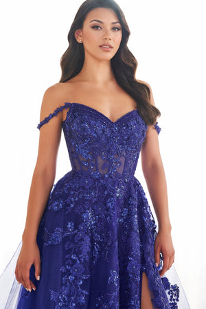Live a real life fairy tale at this years prom wearing this princess worthy Ellie Wilde long dress style EW32604 made in regal shades of tulle fabric. This impeccable gown showcases an illusion corset bodice adorned with lace appliques and beads with thin straps that can be worn on or off the shoulder and a zipper closure back. The a line long skirt has both glitter tulle and tulle layers with a front side slit and side pockets.