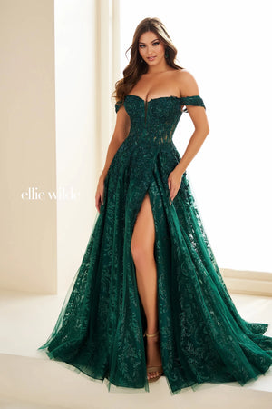 Feel dramatic and glamorous like you just stepped off the red carpet in this gorgeous Ellie Wilde a line dress style EW36209. The off the shoulder bodice neckline is bedazzled with gorgeous appliques. The novelty tulle a line skirt makes it stand out from the rest with a thigh high front side slit and long flowing train.