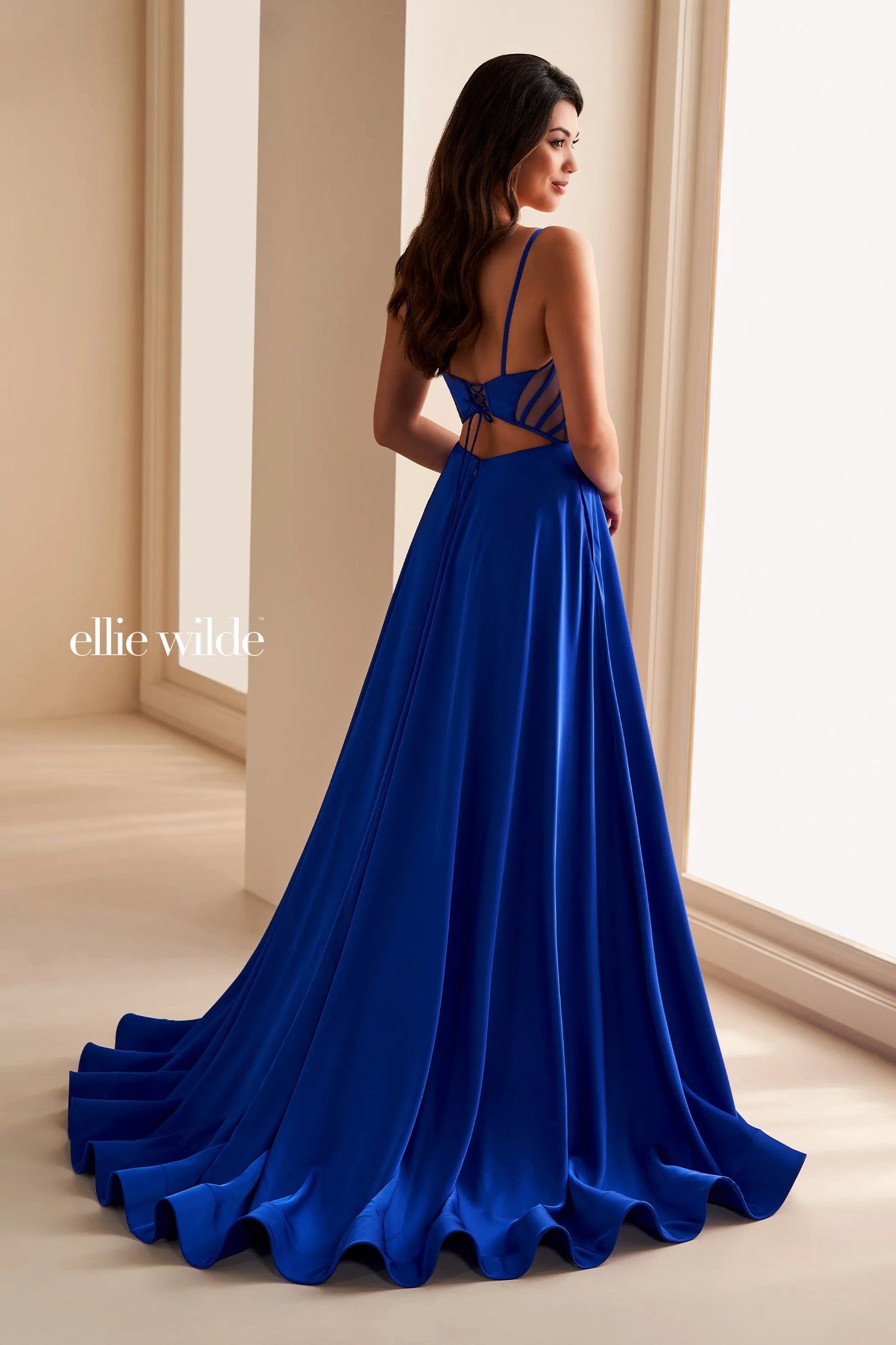 Feel like a diva when wearing this marvelous long dress from Ellie Wilde style EW36227. Showcasing a plunging scoop neckline with a mesh and thin straps. This number consists of a corset lace up back bodice with see through mesh side cut outs and a sext open back. It is made out of satin material and has side pockets that fulfills your diva look.