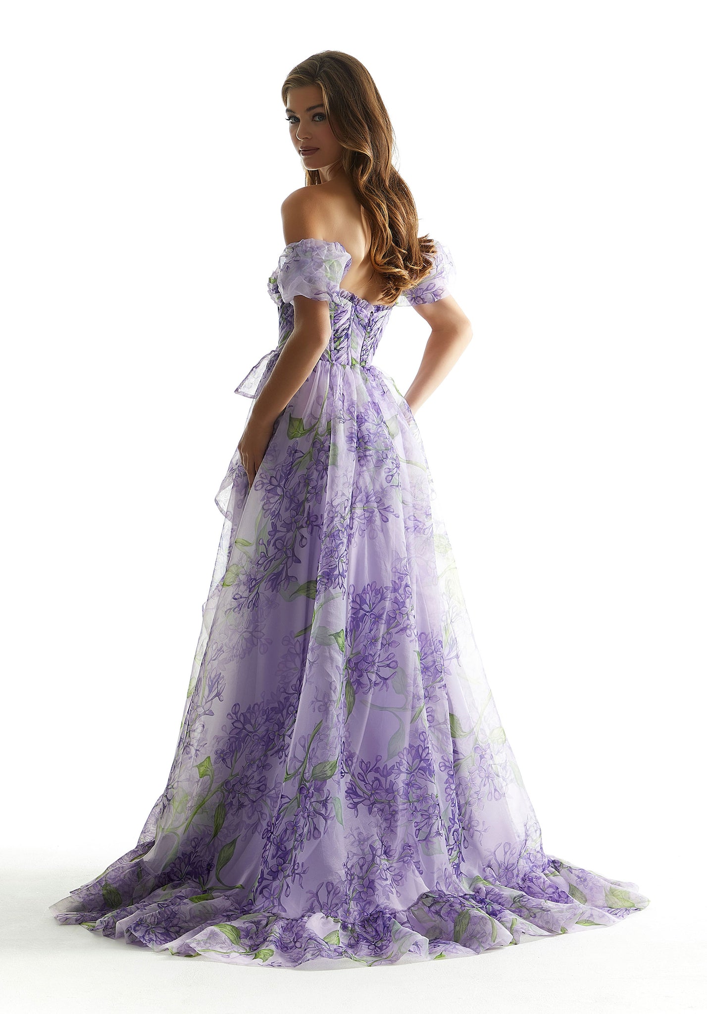 Feel like your living your princess dream in this long dress by Morilee, style 49007. Showcasing an a-line silhouette with a strapless sweetheart neckline that has detachable of the shoulder pouf sleeves. This number has a corset bodice that hugs the body gorgeously and a flowy skirt with a modest slit.