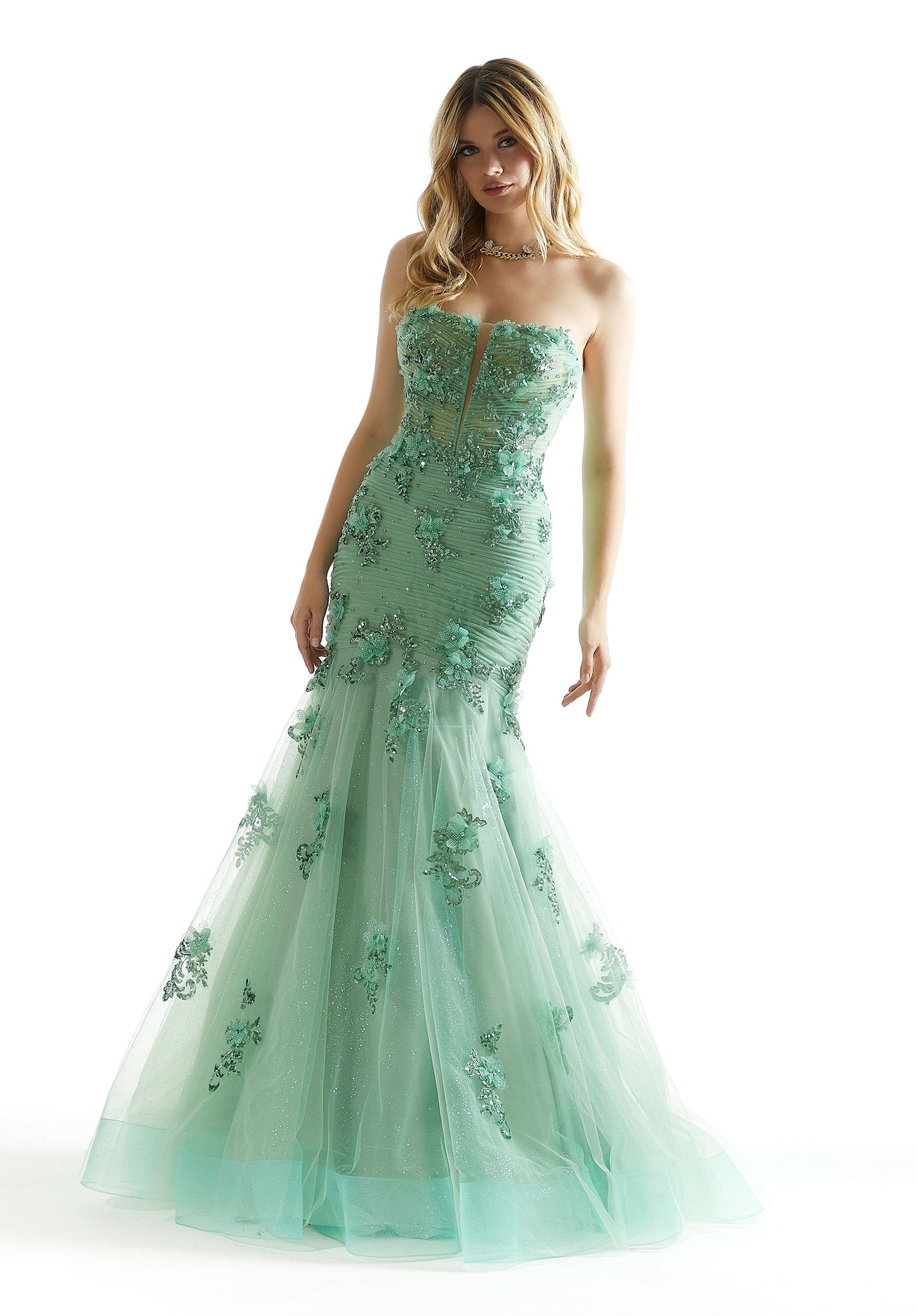 Feel like you just step foot of the red carpet in this fabulous long dress by Morilee, style 49008. Featuring a fitted mermaid silhouette with a strapless scoop neckline. This number is adorned with glistening beadwork and dazzling applique. A corset lace up back is sure to hug the waist gorgeously and give you that hour glass figure.