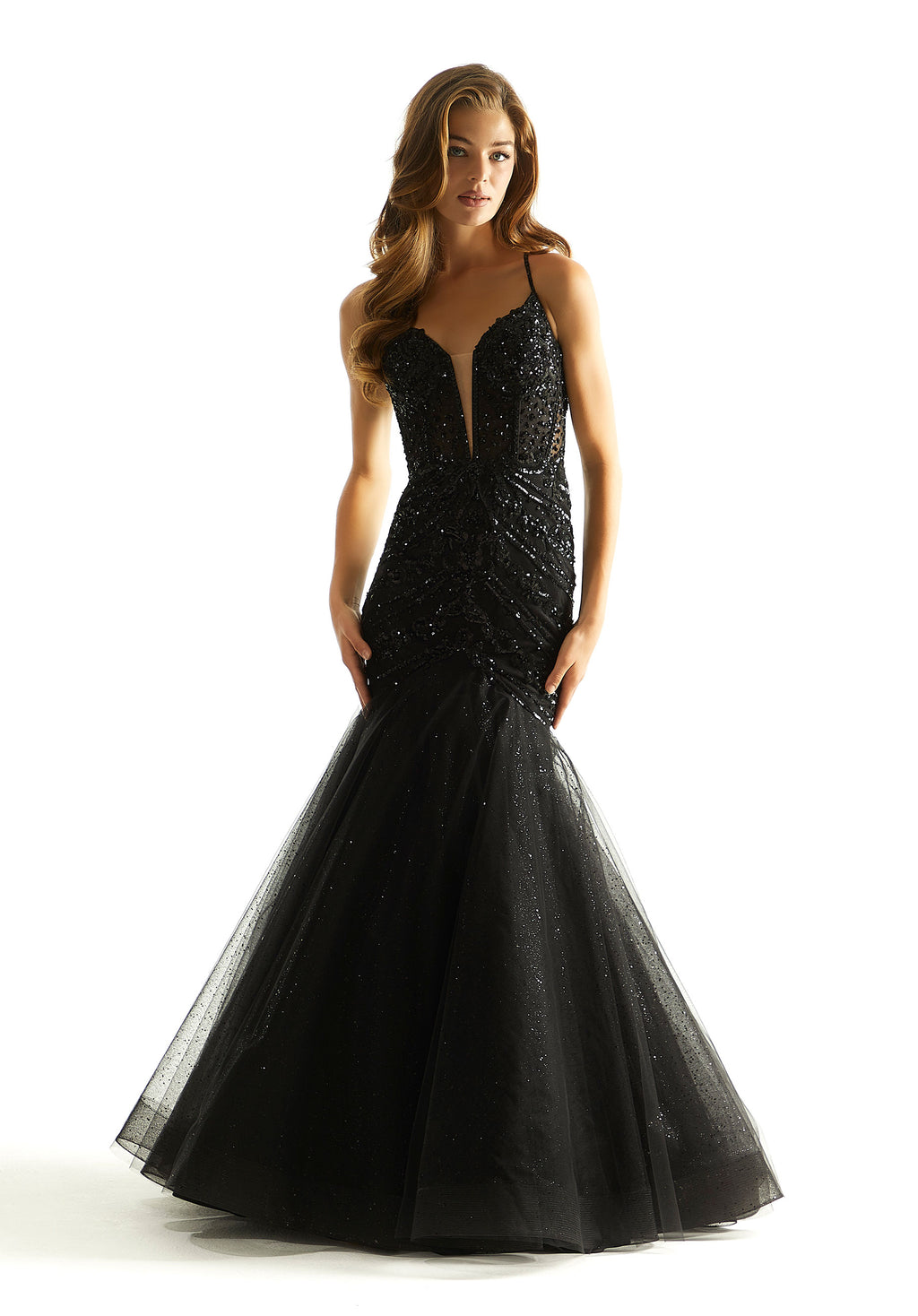 Feel classy and elegant in this magnificent long dress by Morilee, style 49014. Showcasing a mermaid silhouette with plunging v neckline that has mesh for q modest touch. This ensemble is adorned with glistening sequins and dazzling beadwork. The corset bodice is sure to hug your body gorgeously. The tulle skirt has glitter for a touch of sparkle.