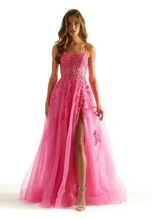 Feel like a modern day princess in this fabulous long dress by Morilee, style 49023. Showcasing an a-line silhouette with a scoop neckline. The corset top has gorgeous embroidery that cascades down the dress. Glistening beadwork and glittered tulle adorn the skirt. A thigh high slit is the perfect final touch.
