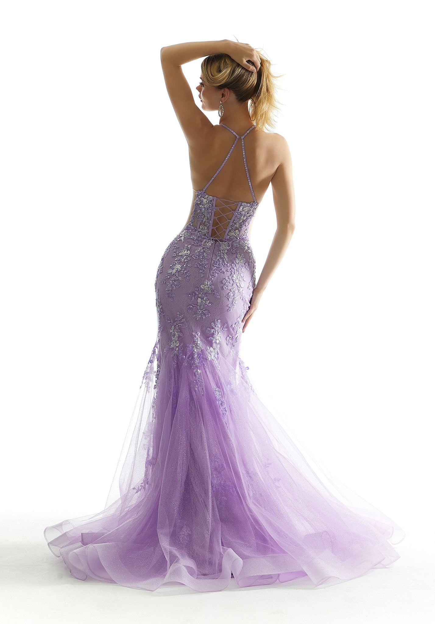 Red carpet ready, this astonishing mermaid Morilee gown 49073 will mesmerize all in sight. Showcasing a sophisticated high halter neckline, sheer midriff panels accentuate your figure beautifully. Flattering on all the lace up closure defines your figure, highlighting your hourglass silhouette. Gleaming beaded appliques adorn the entire silhouette giving this gown the perfect pop of glitz.