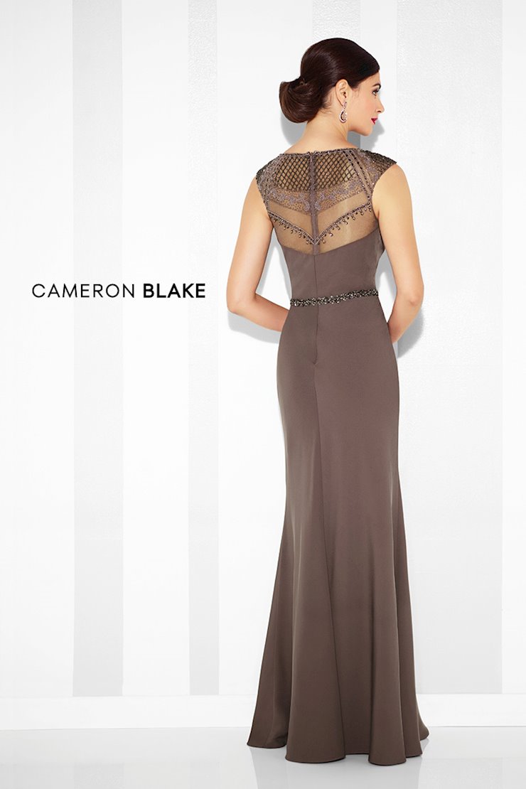 Twill slim A-line gown with hand-beaded illusion slight cap sleeves and jewel neckline, sweetheart bodice, matching beaded illusion back, beaded natural waistline.  Sizes: 4-20  Available in Black, Champagne, Cobalt Blue, Navy Blue, Smoky Mink  If we do not have your desired size or color in stock please call or email us for availability!