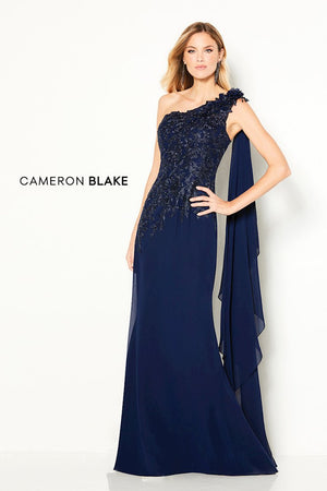 One-shoulder chiffon slim A-line gown offers an asymmetrical neckline with 3-D flowers, beading on the front, attached chiffon streamer down the back, a natural waist bodice with embroidered lace asymmetrically down the hip, sweep train. Sizes: 4-20, 16W-26W Available in Navy Blue, Smoke