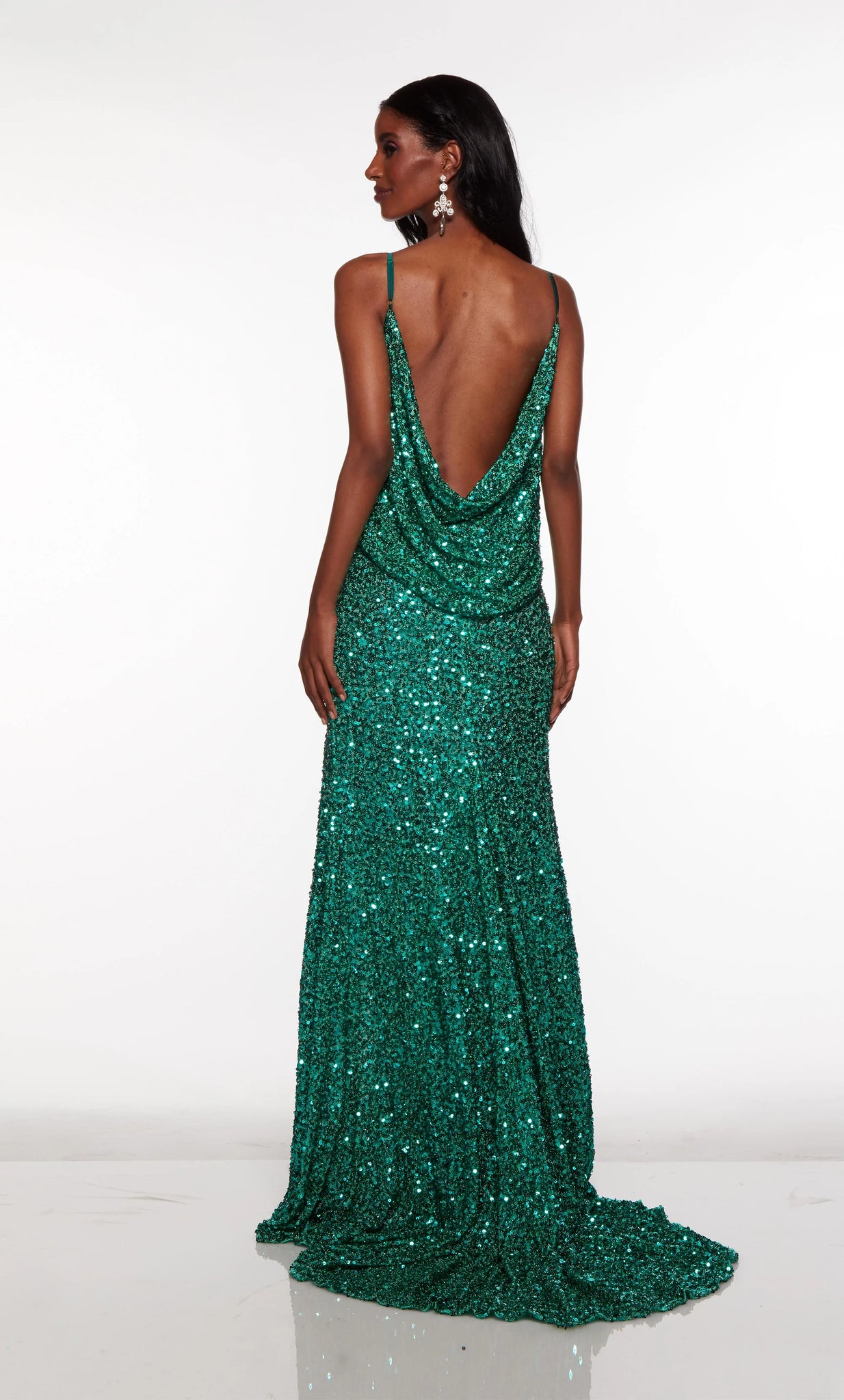 Live out your celebrity dream while wearing captivating Alyce Paris dress 61390. Gorgeous fitted dress displays a cowl neckline that matches the stunning open back cowl detail. Entirely embellished in shimmering sequins, this ravishing dress is accompanied by a high slit. Definitely a must have dress for your next event.