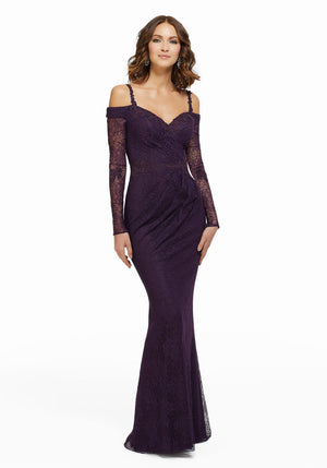 Lace evening gown featuring beaded lace appliques and detachable long sleeves. Sheath silhouette.  Sizes: 2-24 Available in Eggplant only  If we do not have your desired size or color in stock, please call or email us for availability!