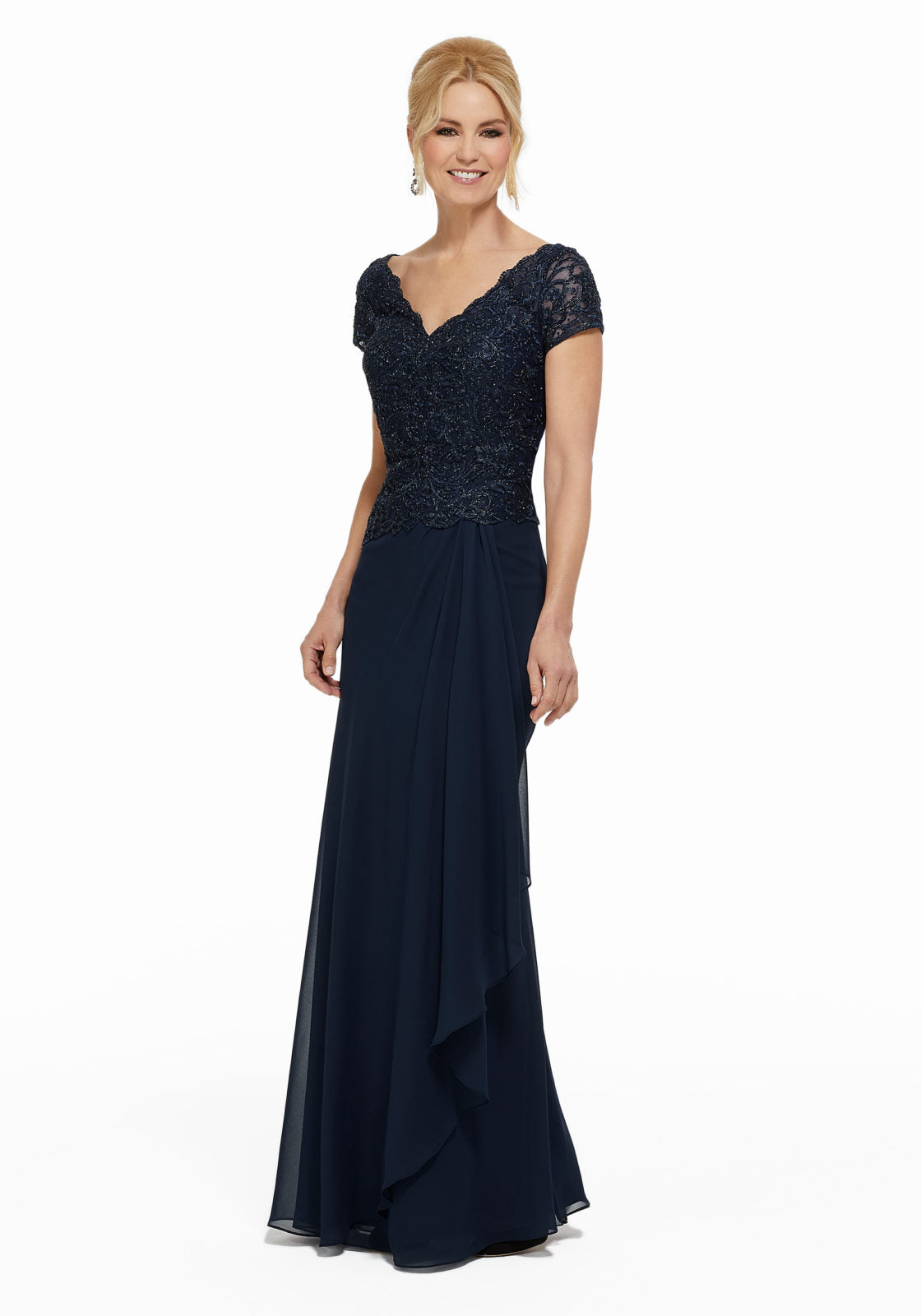 Chiffon evening gown featuring beaded lace appliques on a net bodice with short sleeves. Sheath silhouette with cascading detail on skirt.  Sizes: 2-24  Available in Wine, Navy  If we do not have your desired size or color in stock please call or email us for availability!
