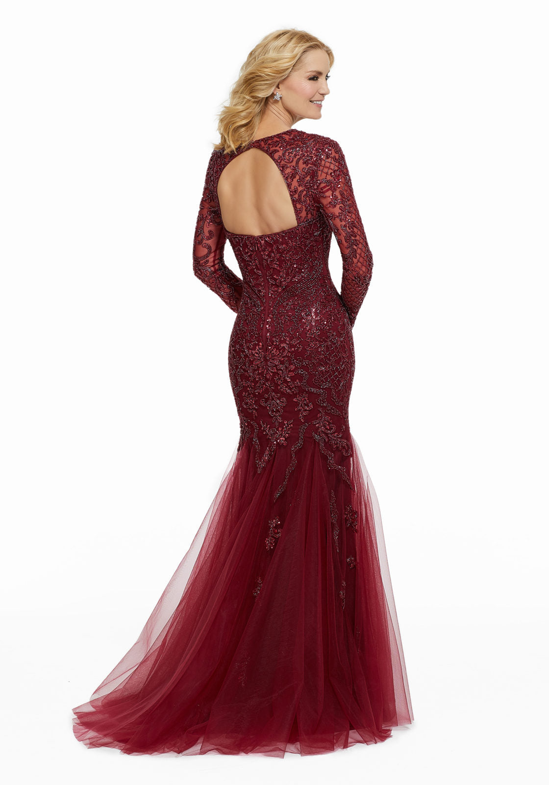 Tulle evening gown featuring allover beading with long sleeves and sweetheart neckline. Mermaid silhouette. **Picture not available in Charcoal**  Sizes: 2-24  Available in Charcoal, Black, Wine  If we do not have your desired size or color in stock please call or email us for availability!