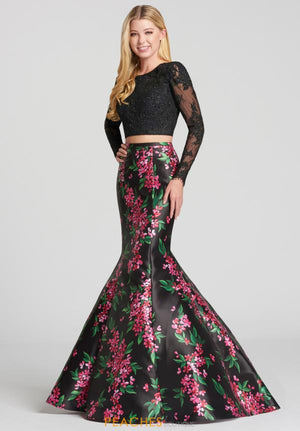 Two piece lace top with floral printed mikado mermaid skirt. Beautiful detailed back, thick floral straps that match the skirts material with amazing lace long sleeves. *Navy shown in picture not available*  ONLY 1 IN STOCK   DISCONTINUED STYLE