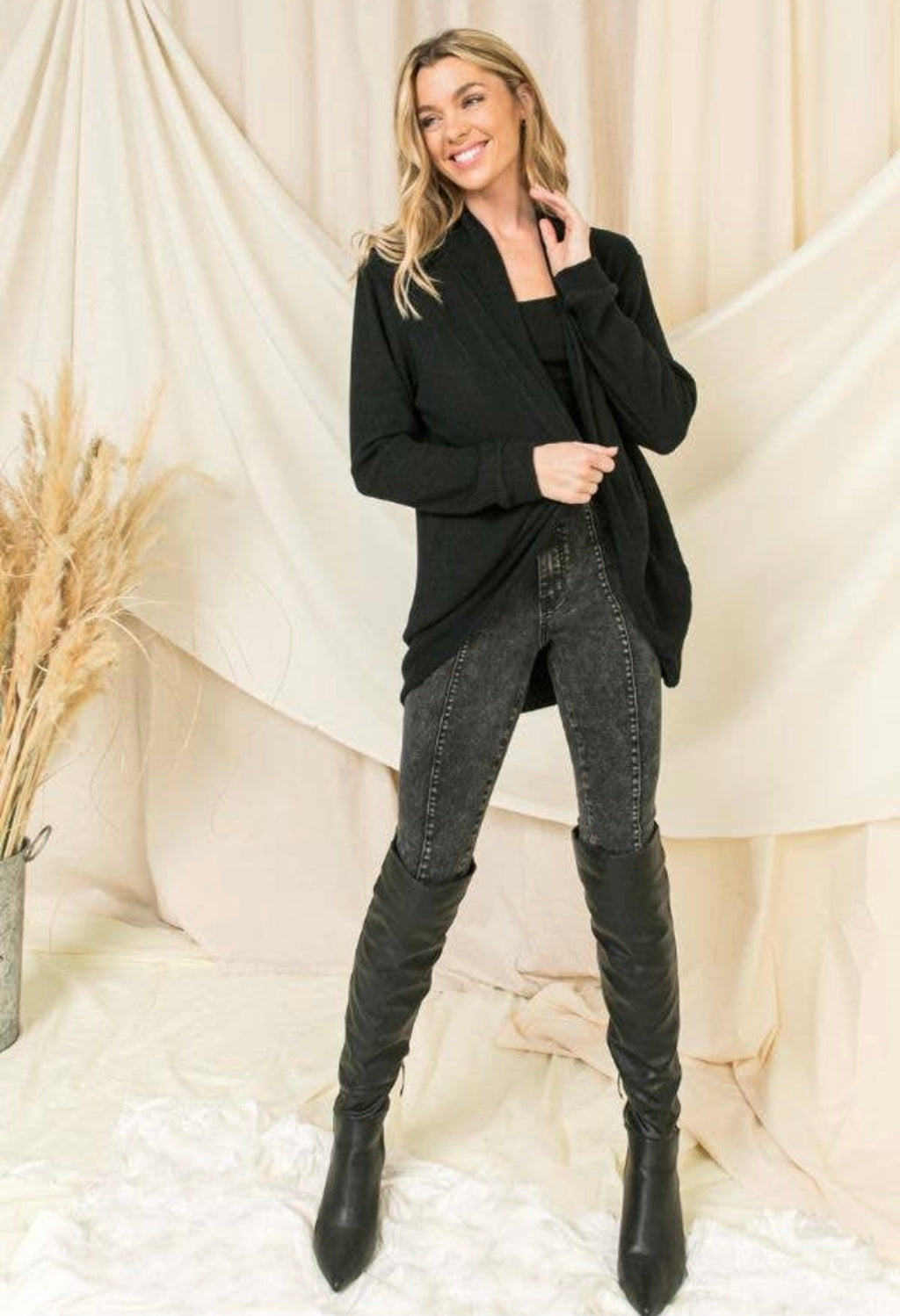 black cardigan sweater. A light, soft knit long sleeve cover up to wear over anything anytime of the year!