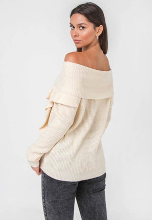 Off the shoulder knit sweater with ruffled accents.  cream in color