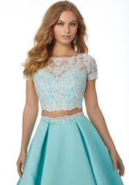 Sophisticated two-piece ballgown featuring a lace, short sleeved keyhole back bodice and full satin a-line skirt.     ONLY 1 IN STOCK  DISCONTINUED STYLE 