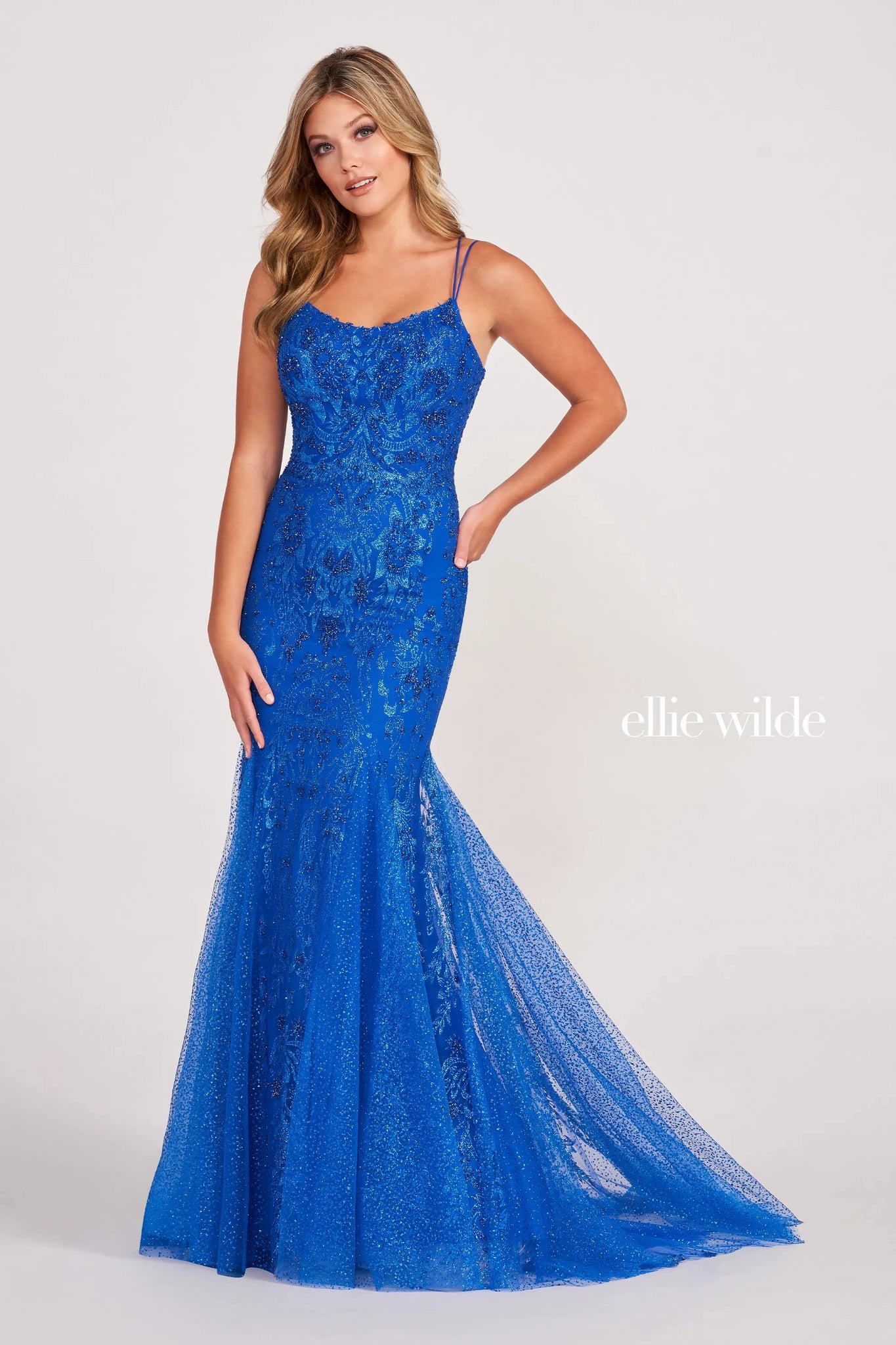 Have a fascinating night when making your entrance in the dazzling long style EW34045 by Ellie Wilde. Headlining the sparkling detailing that gorgeously decorates the entire gown to the very bottom of the beautiful flyaway train. Showcasing the fit and flare silhouette to hug you effortlessly in all the right places.