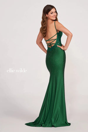 Take the breaths of the entire crowd wearing the eye catching Ellie Wilde style EW34062. Featuring the twinkling hot press stones that decorate the entire dress and will have you dazzling all night long. Showcasing the illusion material that lays over the thigh high slit and makes it way slightly above the thigh. A beautiful flyaway train to follow.
