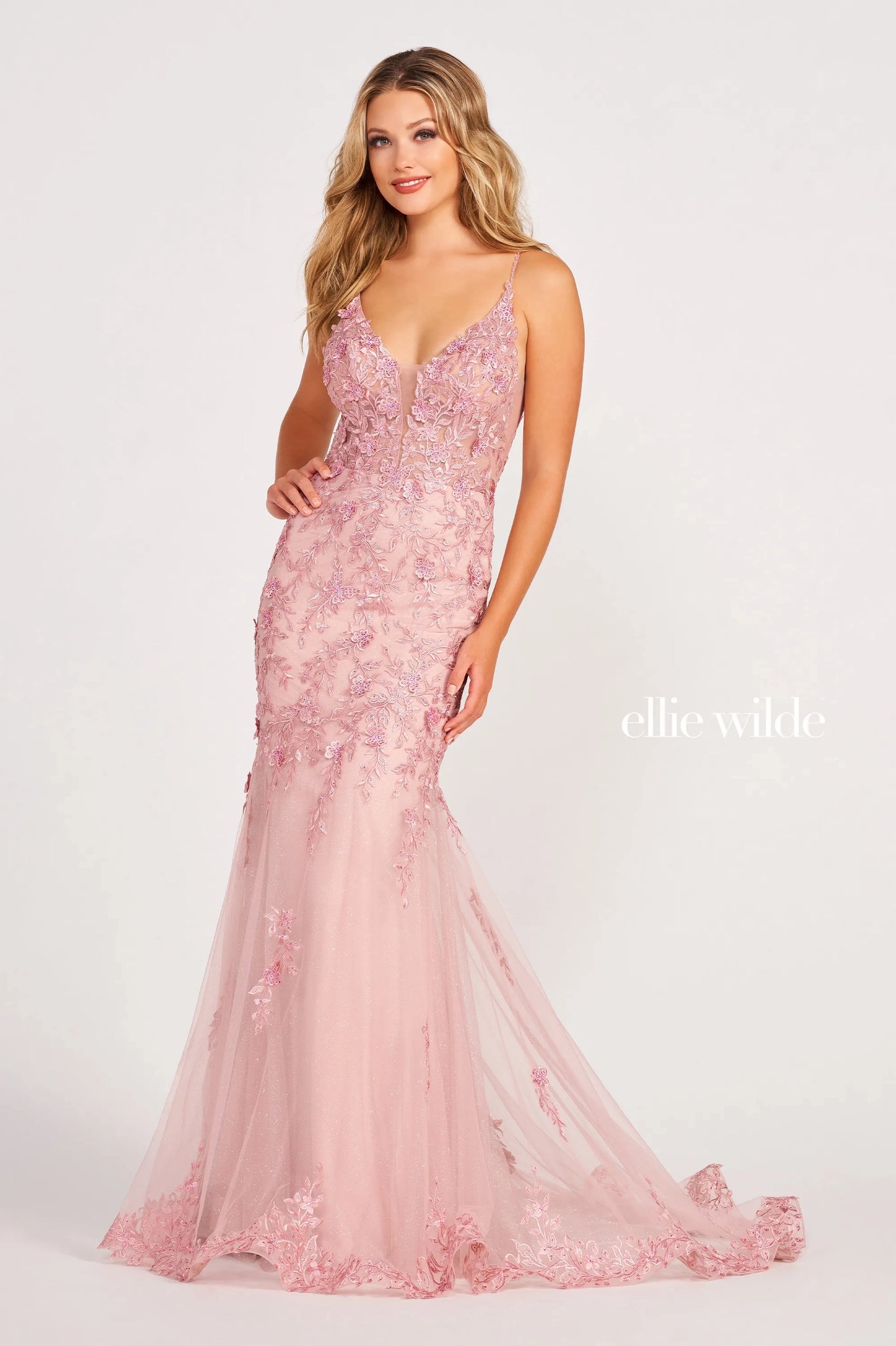 Embrace your celestial charm in this heavenly dress by Ellie Wilde. Designed with a mermaid silhouette, the dress is designed with a faux plunging neckline and a sheer corset bodice. The dress is embellished with beautiful flower appliques and gives the most heavenly elegance.