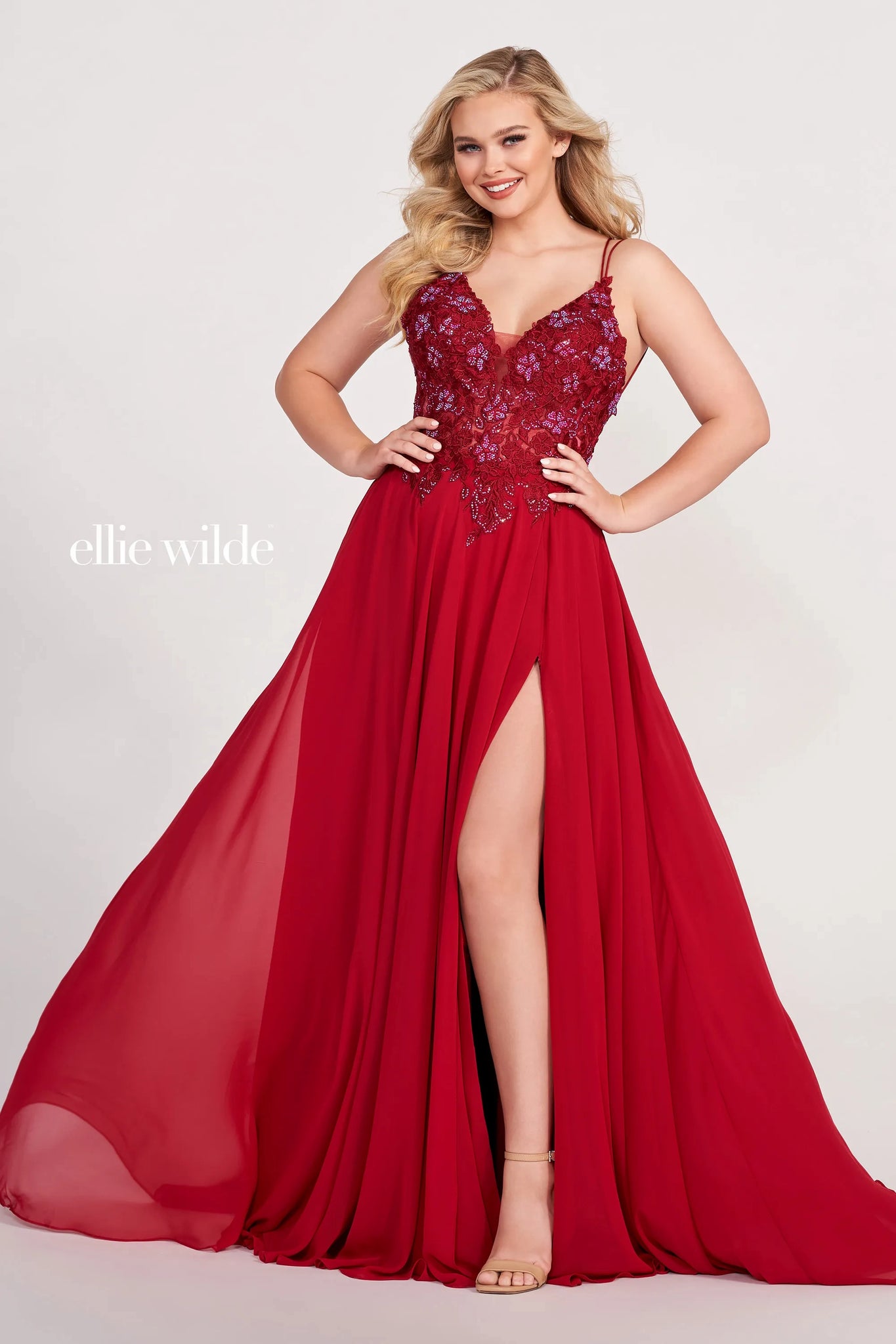 Looking for a show-stopping dress that will turn heads? Look no further than the Ellie Wilde EW34078. This gorgeous dress features intricate embroidered lace with three-dimensional flowers and stone accents. The flowing chiffon material is perfect for a night out on the town or a special event. You're sure to dazzle in this stunning dress!