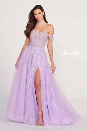 This Ellie Wilde EW34081 light peach prom dress features a semi-sheer corset bodice with an off-the-shoulder sweetheart neckline and an open laced-up back. This A-line formal gown is crafted in glitter tulle with beaded floral appliques, finished with a thigh-high slit, side pockets, horsehair hem, and semi-chapel train.