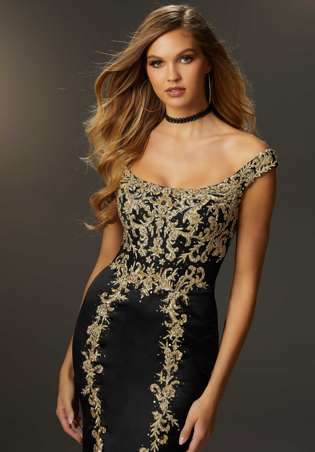 Regal and sophisticated, this mesmerizing Morilee dress 48012 will fascinate all in sight. Be the envy of all in this astonishing gown, an ideal choice for any social occasion. Showcasing an elegant off the shoulder neckline, this fitted gown shows off your curves perfectly. Lavish elaborate appliques and shimmering beads create an elaborate embroidery that adorns the bodice and gracefully transition onto the fit an flare skirt.