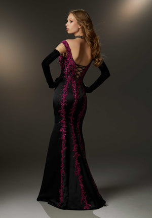 Regal and sophisticated, this mesmerizing Morilee dress 48012 will fascinate all in sight. Be the envy of all in this astonishing gown, an ideal choice for any social occasion. Showcasing an elegant off the shoulder neckline, this fitted gown shows off your curves perfectly. Lavish elaborate appliques and shimmering beads create an elaborate embroidery that adorns the bodice and gracefully transition onto the fit an flare skirt.