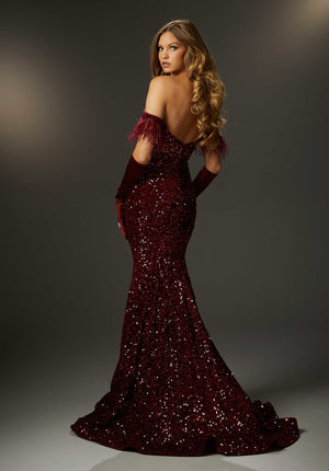 Steal the show in haute long dress 48021 by Morilee. This dress is marvelous with stunning combinations of feathers and sequins. The fitted cut of this dress is made from a velvet sequin fabric that will hug and flatter your natural figure while giving you the perfect amount of sparkle. The strapless neckline pairs hand in hand with the off the shoulder feathered cap sleeves. Gloves not included, but can be accessorized with.