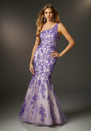 Pretty mermaid prom dress sparkles with crystal beaded, patterned sequins accented by delicate embroidery on glitter tulle for the extra pop of bling. The one-shoulder neckline is totally chic and leads to a cool strappy back.